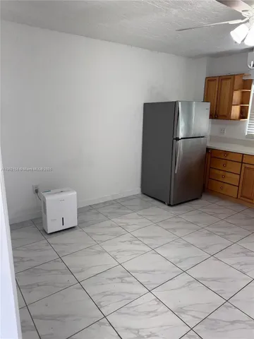 a kitchen with cabinets and stainless steel appliances