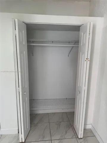a view of an empty walk in closet