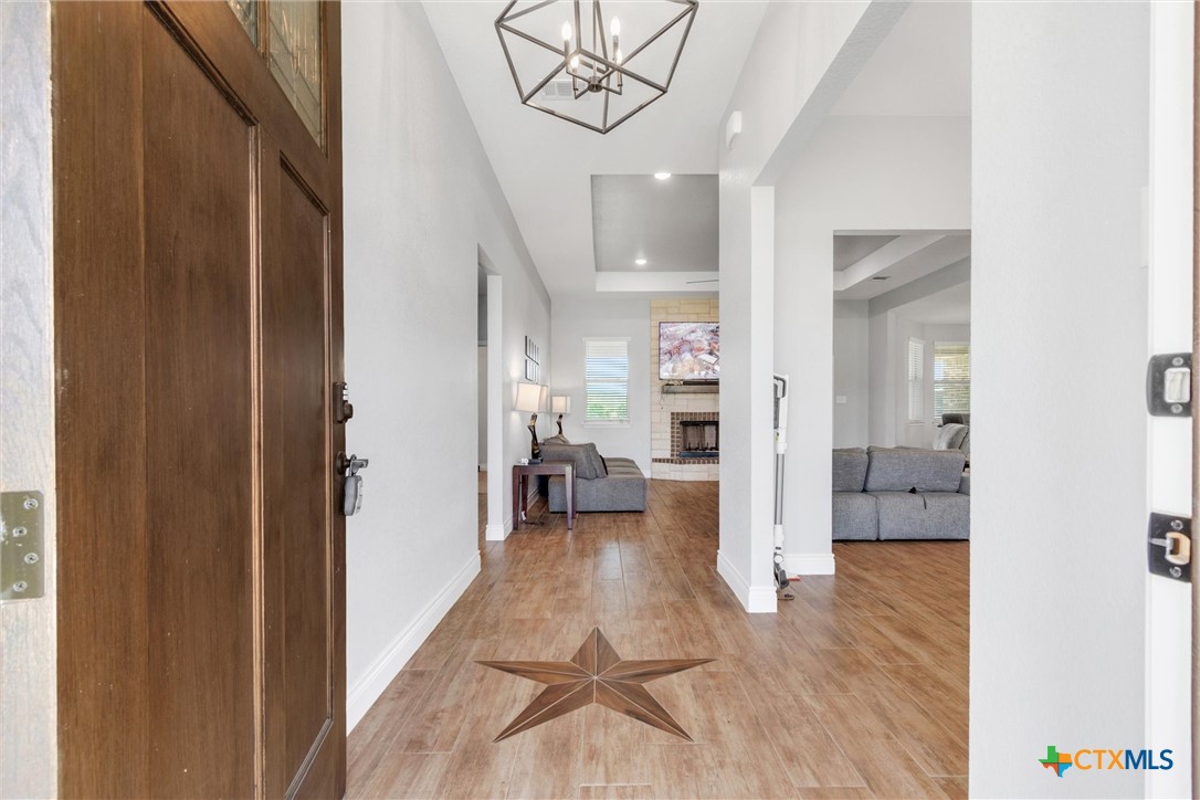 3919 Gracey Lane Kempner, TX 76539 - Photo 6 of 44 a view of a hallway view with wooden floor and furniture