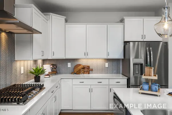 a kitchen with a dining table and chairs