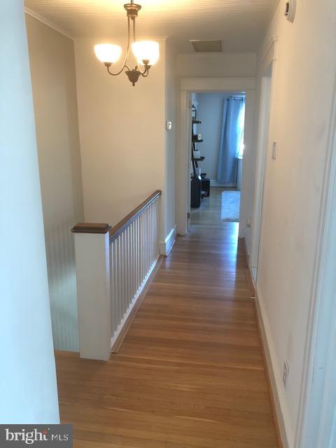 41 Chatham Road Ardmore, PA 19003 - Photo 15 of 20 a view of a hallway with wooden floor and staircase