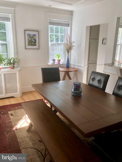 41 Chatham Road Ardmore, PA 19003 - Photo 7 of 20 a view of kitchen island with stainless steel appliances a sink dishwasher and a dining table with wooden floor