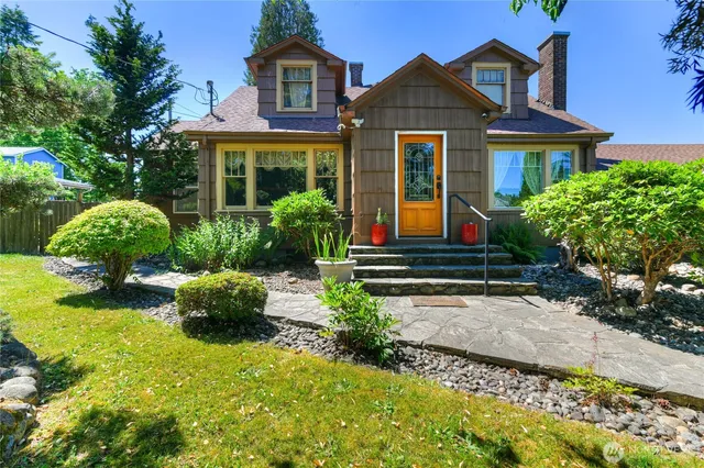 a front view of a house with garden
