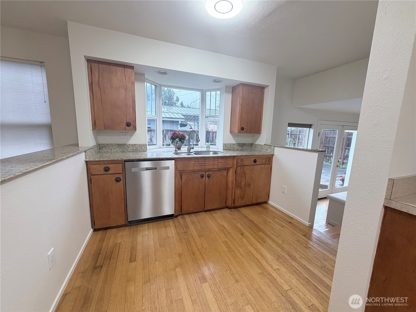 517 South 3rd Street McCleary, WA 98557 - Photo 12 of 38 a kitchen with stainless steel appliances granite countertop a dishwasher a stove with wooden floor