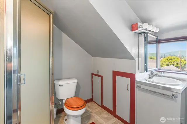 a view of a chair and table in the backyard