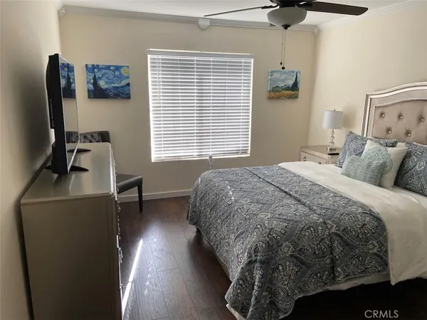 a bedroom with a bed and a chair