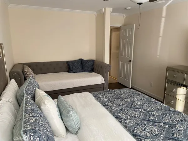 a living room with a couch and a rug