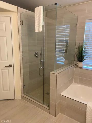 a bathroom with a shower and a sink