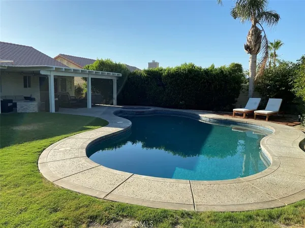 a view of a house with swimming pool