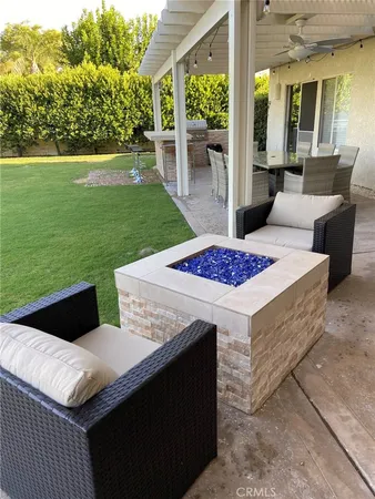 a view of a patio with a table and chairs