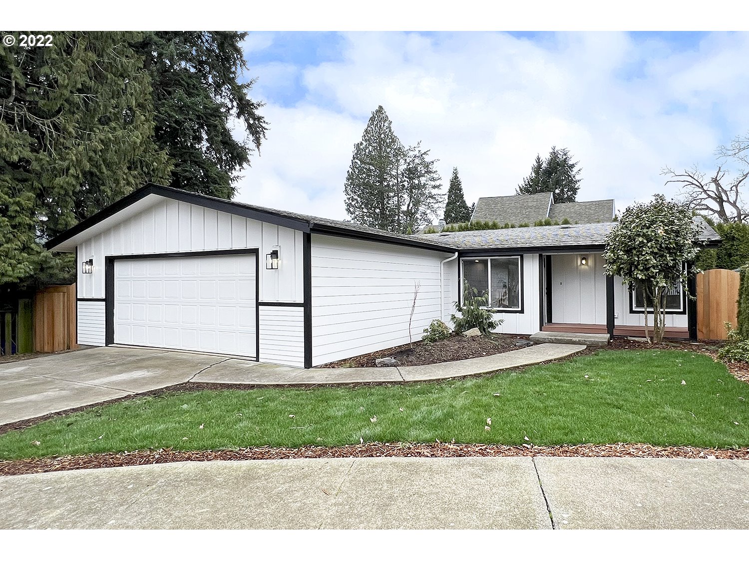 1465 Southeast Maple Loop Gresham, OR 97080 - Photo 2 of 32 a front view of a house with a yard and garage