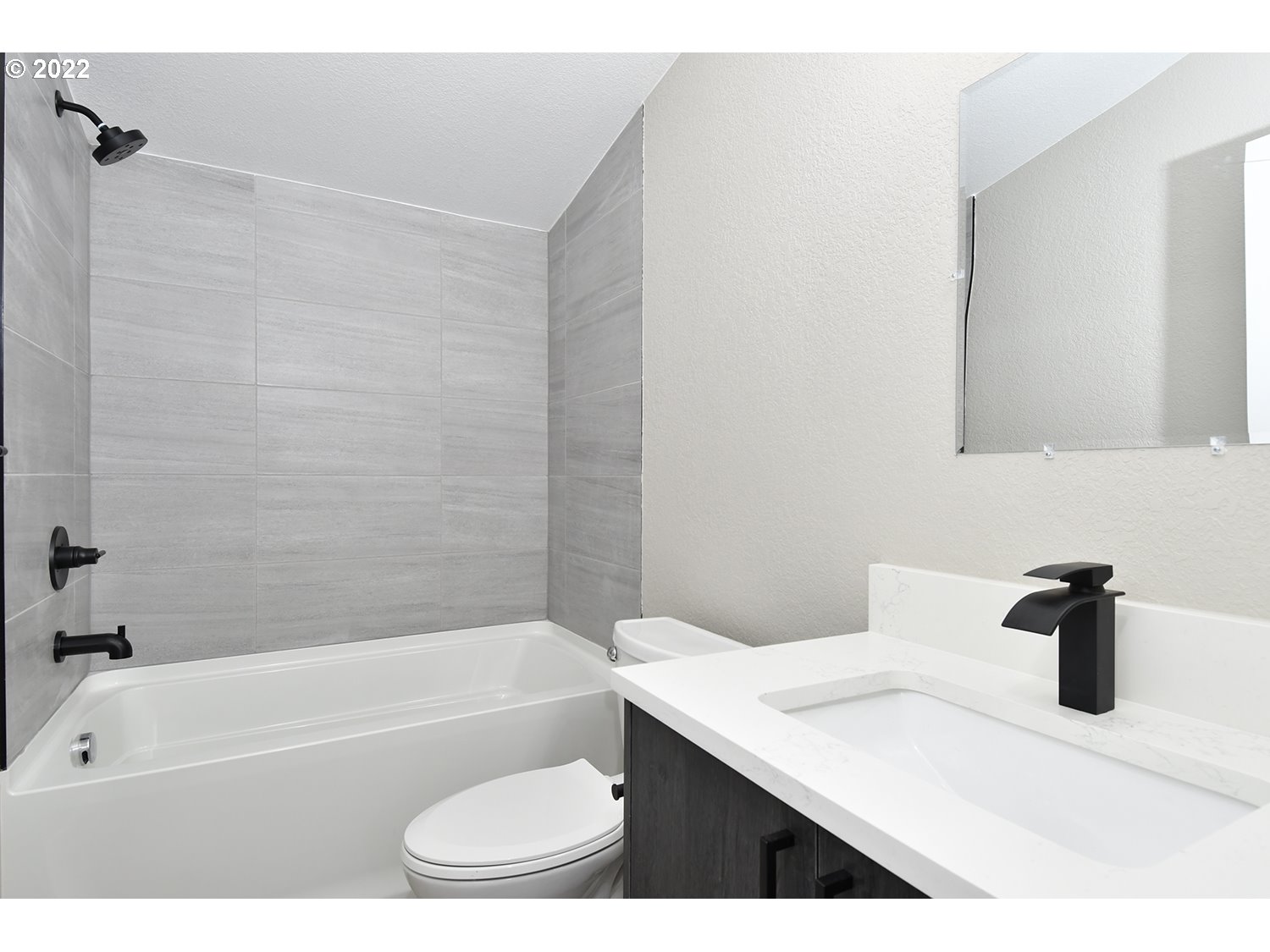 1465 Southeast Maple Loop Gresham, OR 97080 - Photo 21 of 32 a bathroom with a sink a toilet and a bathtub
