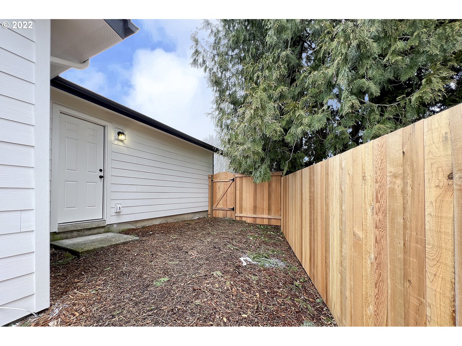 1465 Southeast Maple Loop Gresham, OR 97080 - Photo 28 of 32 a view of a backyard with pathway
