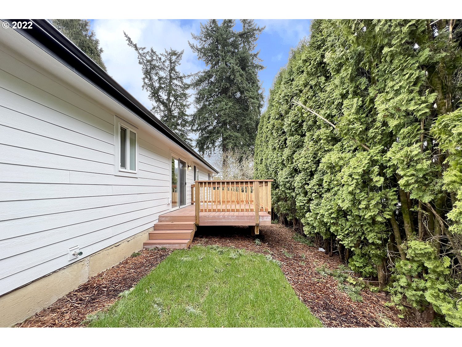 1465 Southeast Maple Loop Gresham, OR 97080 - Photo 30 of 32 a view of a backyard with a garden