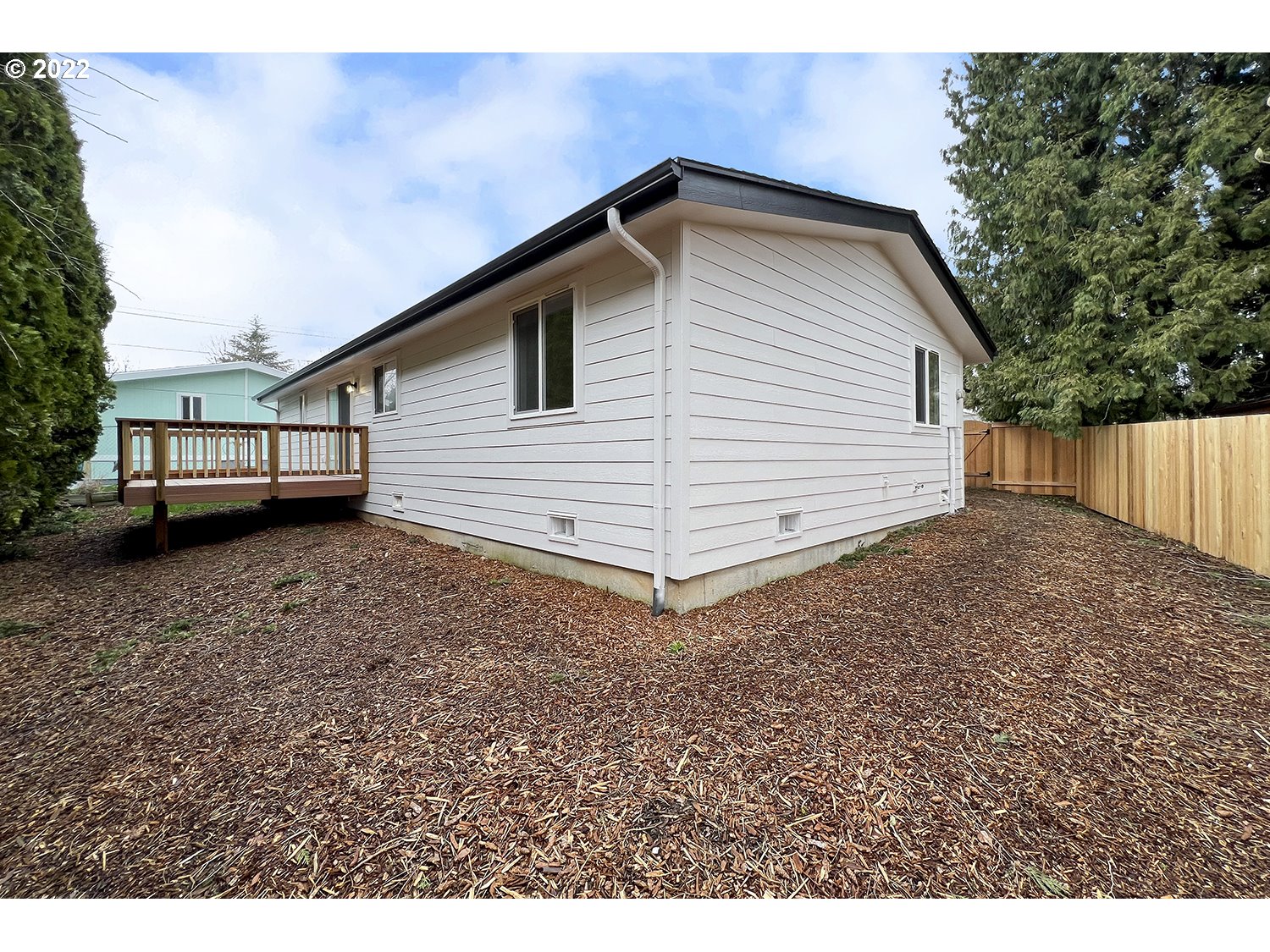 1465 Southeast Maple Loop Gresham, OR 97080 - Photo 31 of 32 a view of a house with a backyard