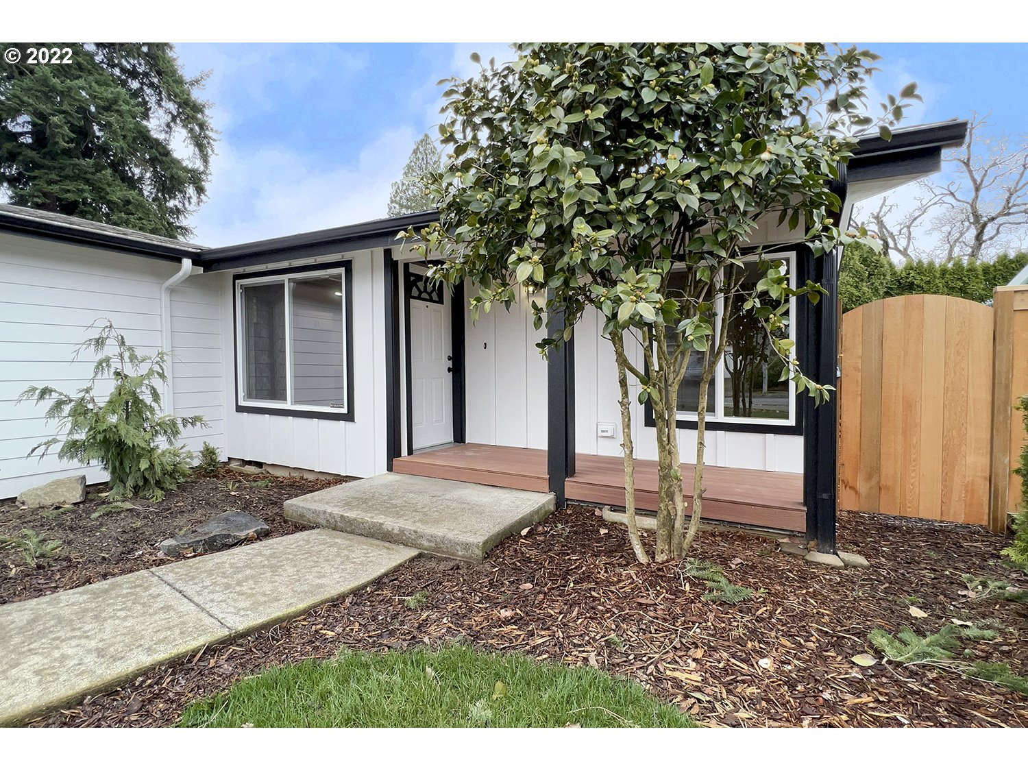 1465 Southeast Maple Loop Gresham, OR 97080 - Photo 6 of 32 a backyard of a house with table and chairs