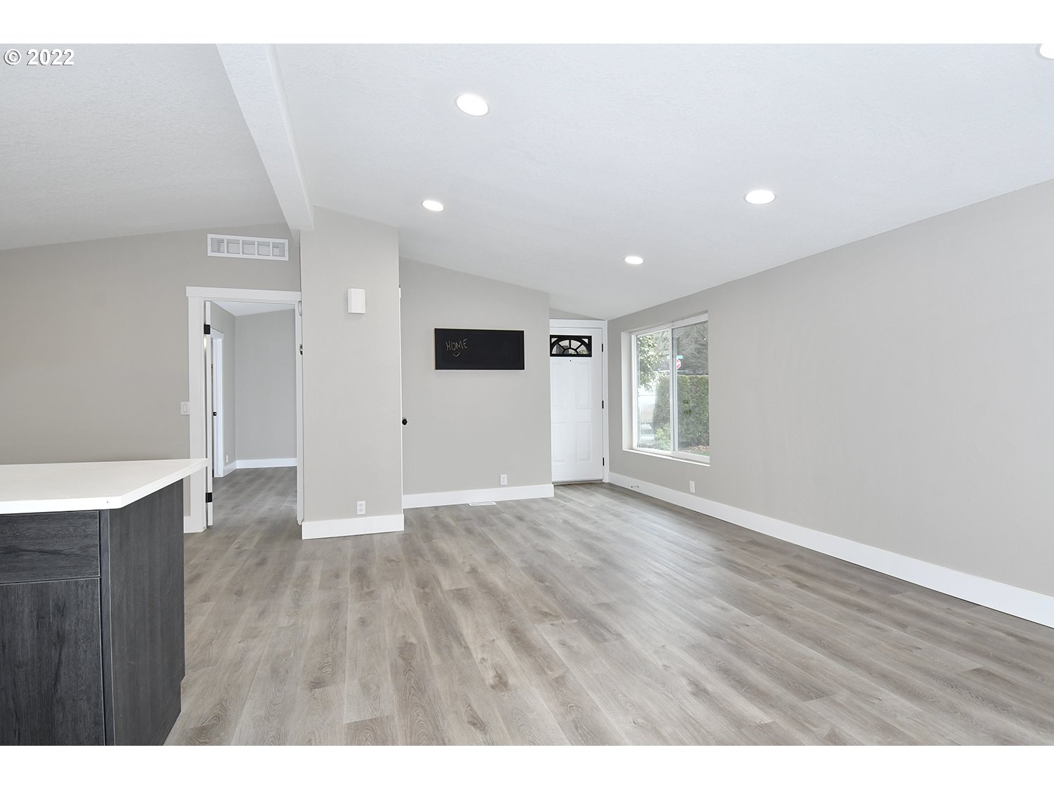 1465 Southeast Maple Loop Gresham, OR 97080 - Photo 9 of 32 a view of an empty room with wooden floor