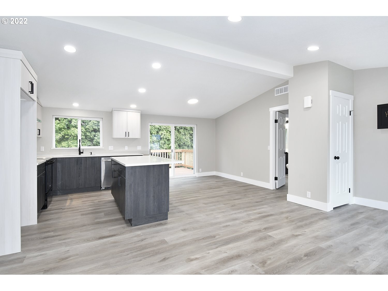1465 Southeast Maple Loop Gresham, OR 97080 - Photo 10 of 32 a kitchen with a wooden floor and window