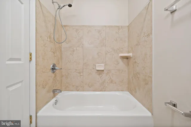 a close view of a bathtub in bathroom