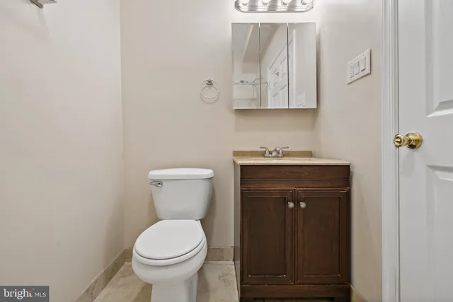 a bathroom with a toilet and a sink