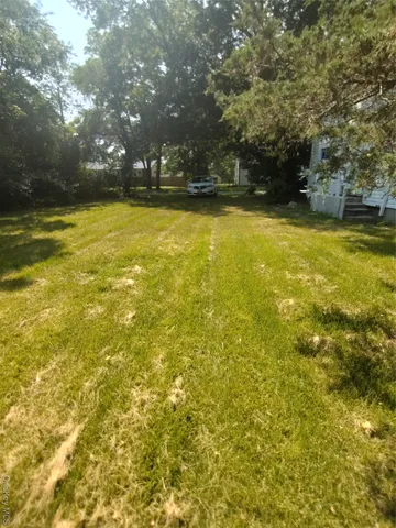 a view of a swimming pool and an outdoor space