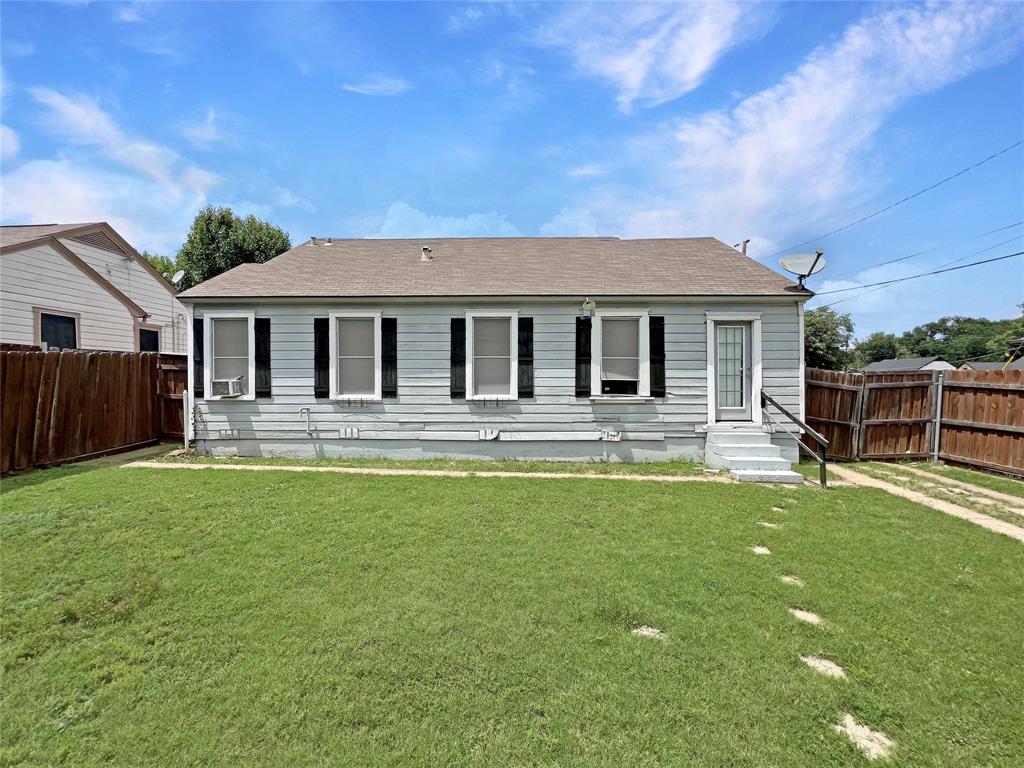 1010 Winters Street Dallas, TX 75216 - Photo 19 of 20 Single-story residence featuring light-colored siding, a brown shingle roof, and black window shutters