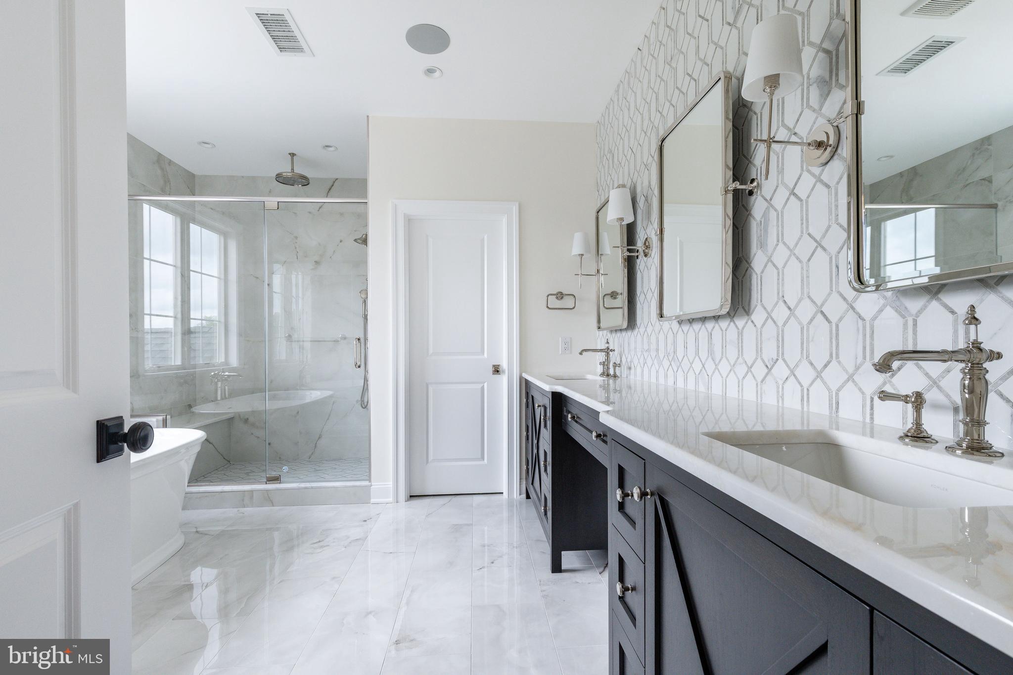 117 Lexington Manor Glenmoore, PA 19343 - Photo 11 of 11 a bathroom with a granite countertop sink a mirror and a shower
