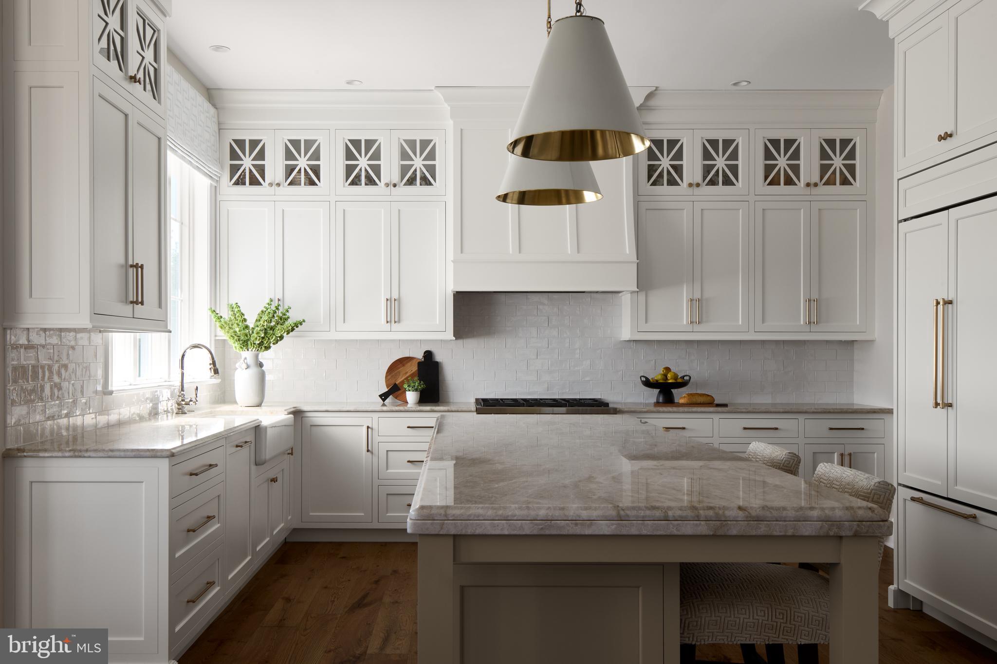 117 Lexington Manor Glenmoore, PA 19343 - Photo 2 of 11 a kitchen with stainless steel appliances a sink a refrigerator and cabinets
