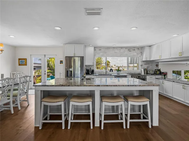 a bathroom with a sink vanity mirror and toilet