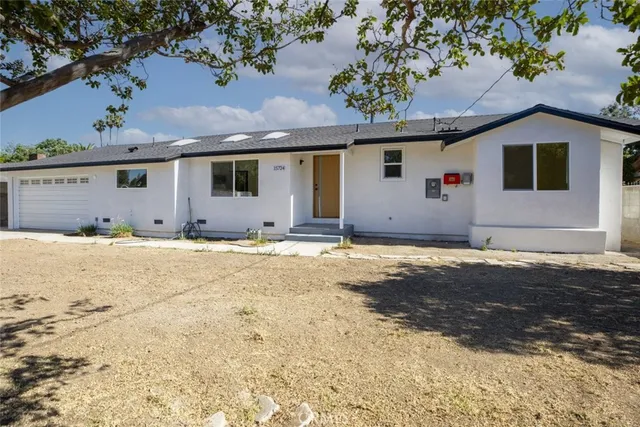 a view of a backyard of a house