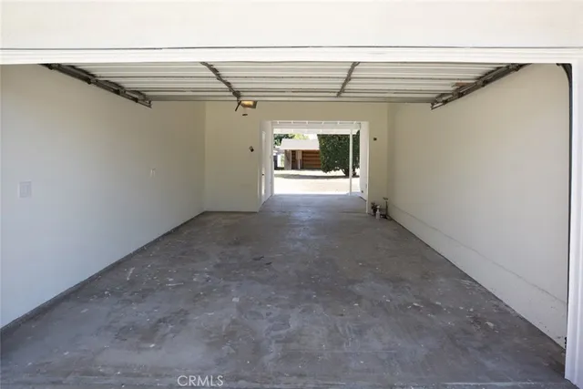 a view of yard with swimming pool and trees