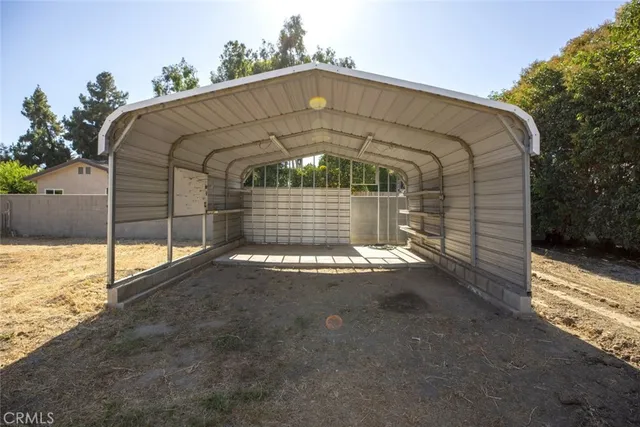 a view of a house with backyard and deck