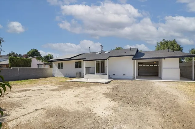 a house view with swimming pool and wooden bench