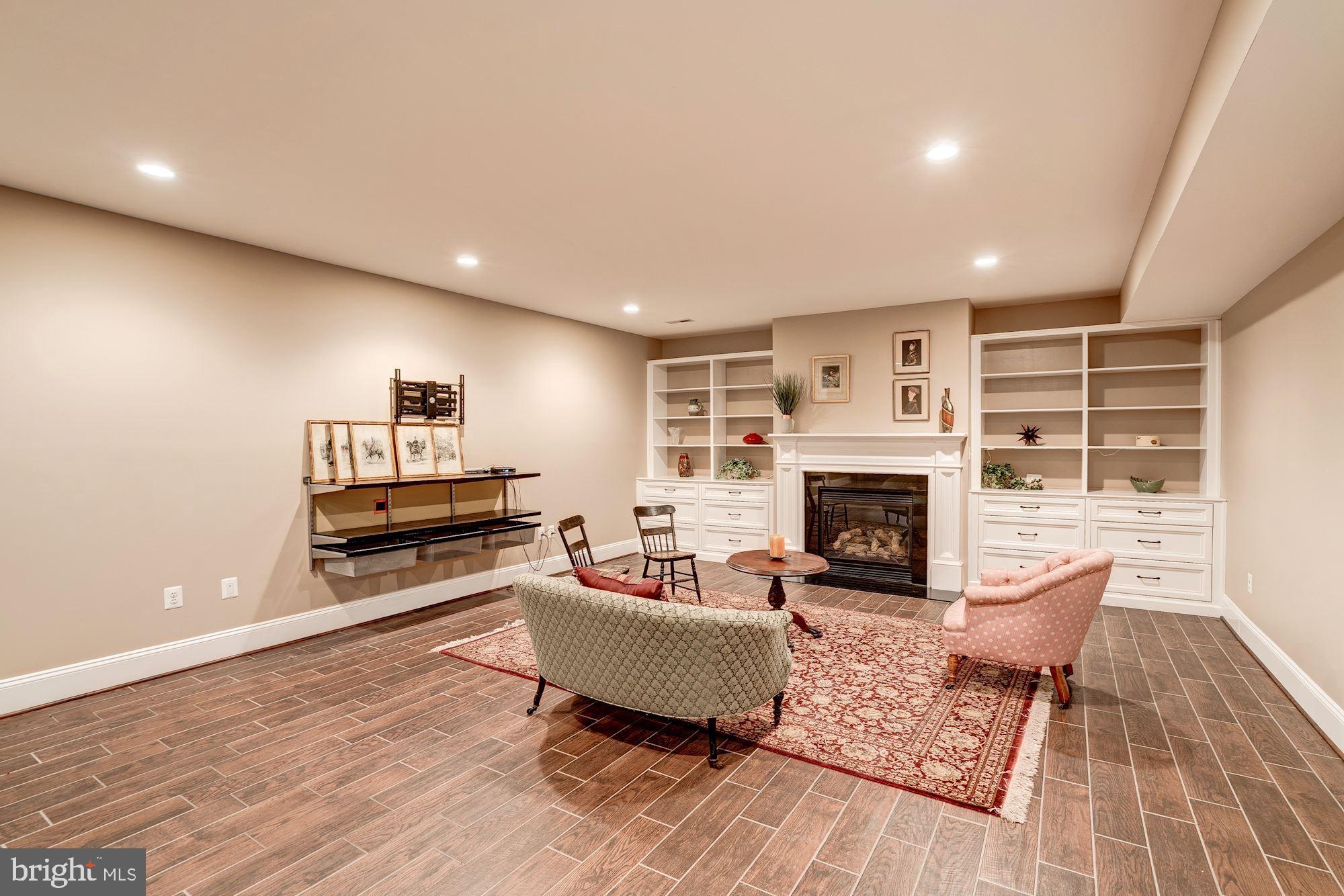 1020 Aponi Road Southeast Vienna, VA 22180 - Photo 44 of 64 Gas fireplace, recessed lights and built ins