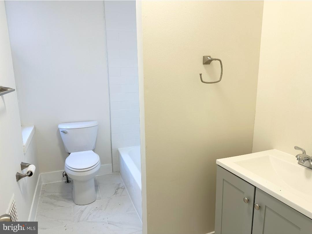 1532 South 2nd Street, Unit 2F Philadelphia, PA 19147 - Photo 17 of 19 a bathroom with a sink and a toilet