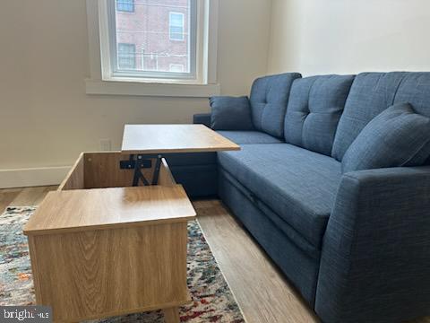 1532 South 2nd Street, Unit 2F Philadelphia, PA 19147 - Photo 9 of 19 a living room with a couch and a table