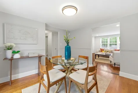 a view of a dining room with furniture window and wooden floor