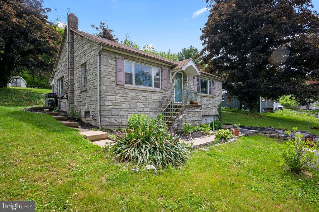 1644 Moselem Spring Road Hamburg, PA 19526 - Photo 2 of 26 Charming stone home with lush greenery.
