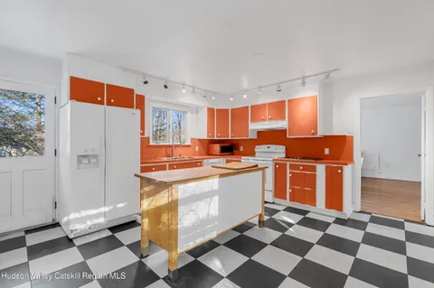 a kitchen with stainless steel appliances a sink and a counter top space