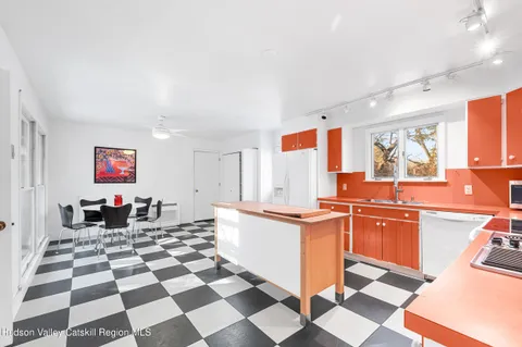 a kitchen with stainless steel appliances granite countertop a refrigerator and a stove