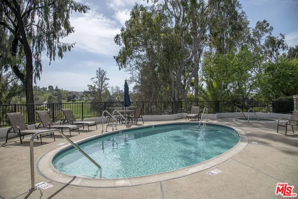 a view of a house with swimming pool