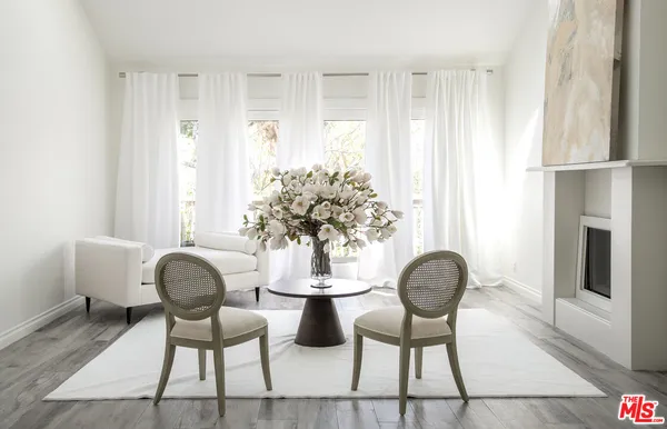 a dining room with furniture and window