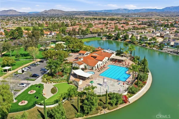 an aerial view of a house with a lake view