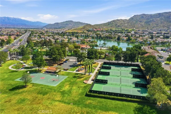 an aerial view of a house with a yard