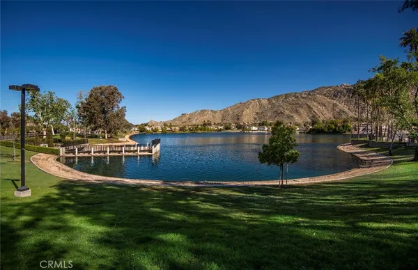 a view of a lake with a yard
