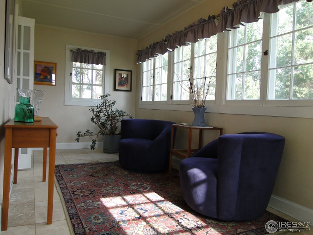 9268 County Road 28 Fort Lupton, CO 80621 - Photo 11 of 25 a living room with furniture and a fireplace