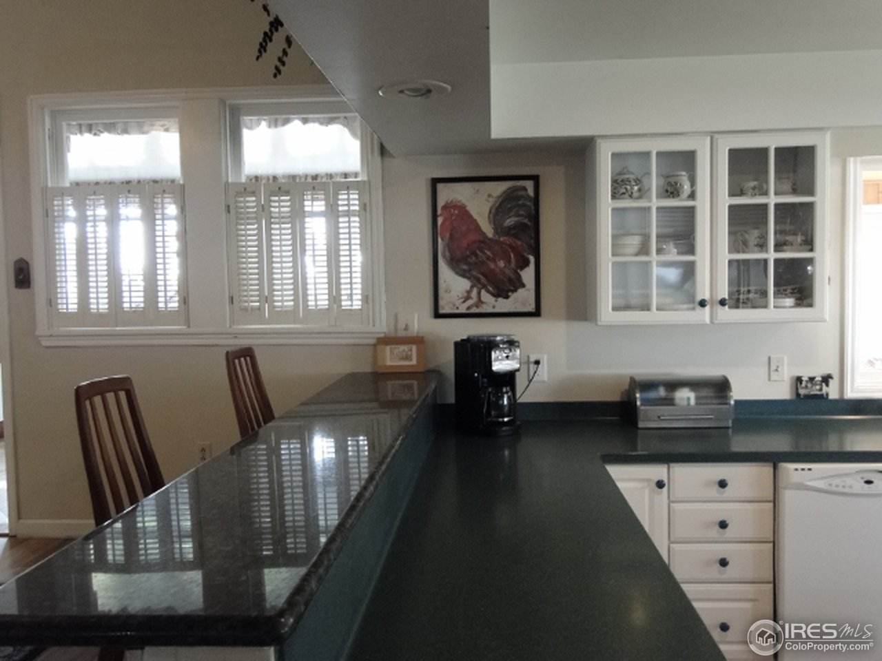 9268 County Road 28 Fort Lupton, CO 80621 - Photo 17 of 25 a view of a dining room with furniture and windows