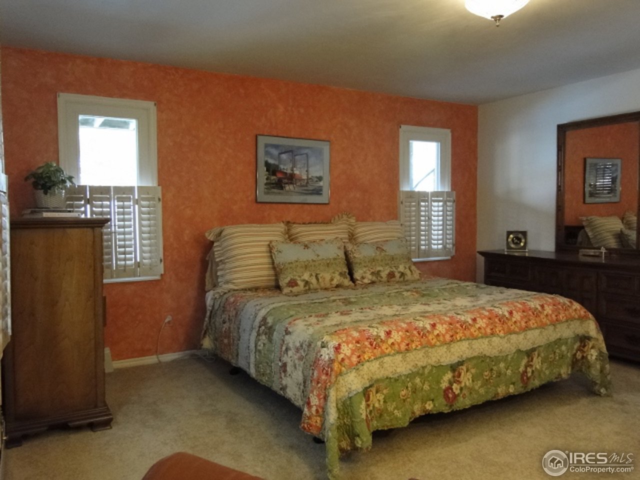 9268 County Road 28 Fort Lupton, CO 80621 - Photo 19 of 25 a bedroom with a bed and window