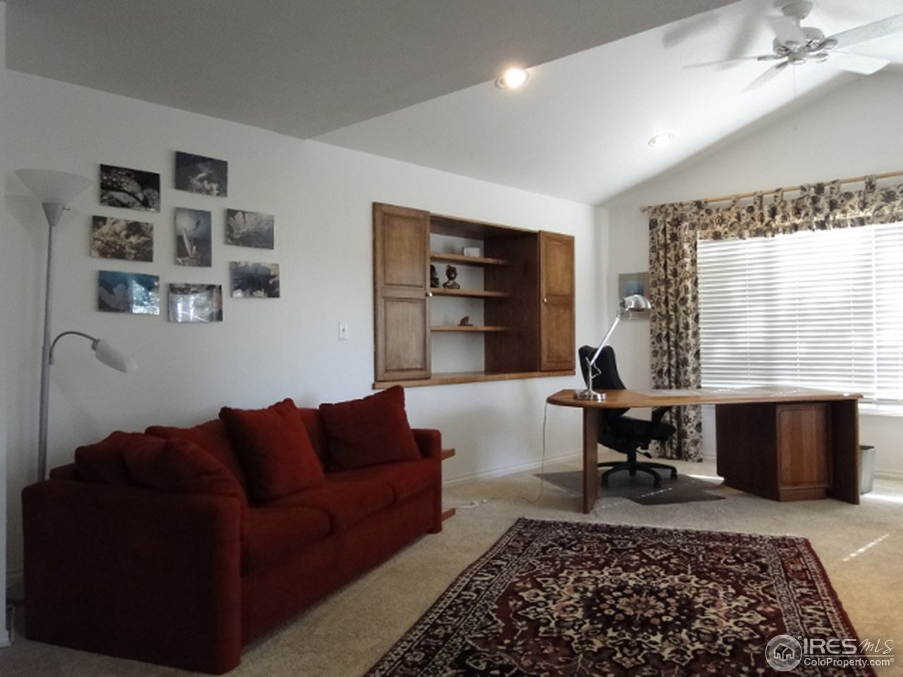 9268 County Road 28 Fort Lupton, CO 80621 - Photo 23 of 25 a living room with furniture or couch and a fireplace