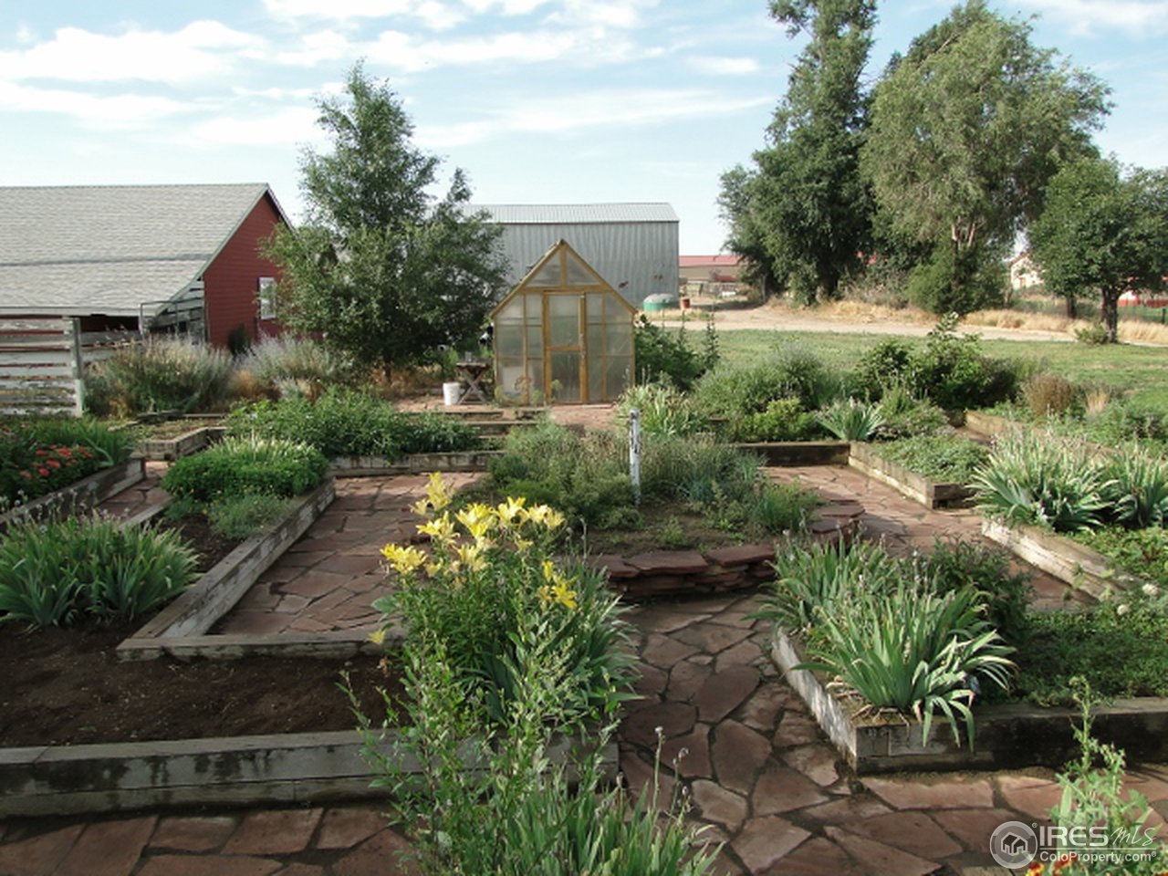 9268 County Road 28 Fort Lupton, CO 80621 - Photo 9 of 25 a view of a garden with pathway